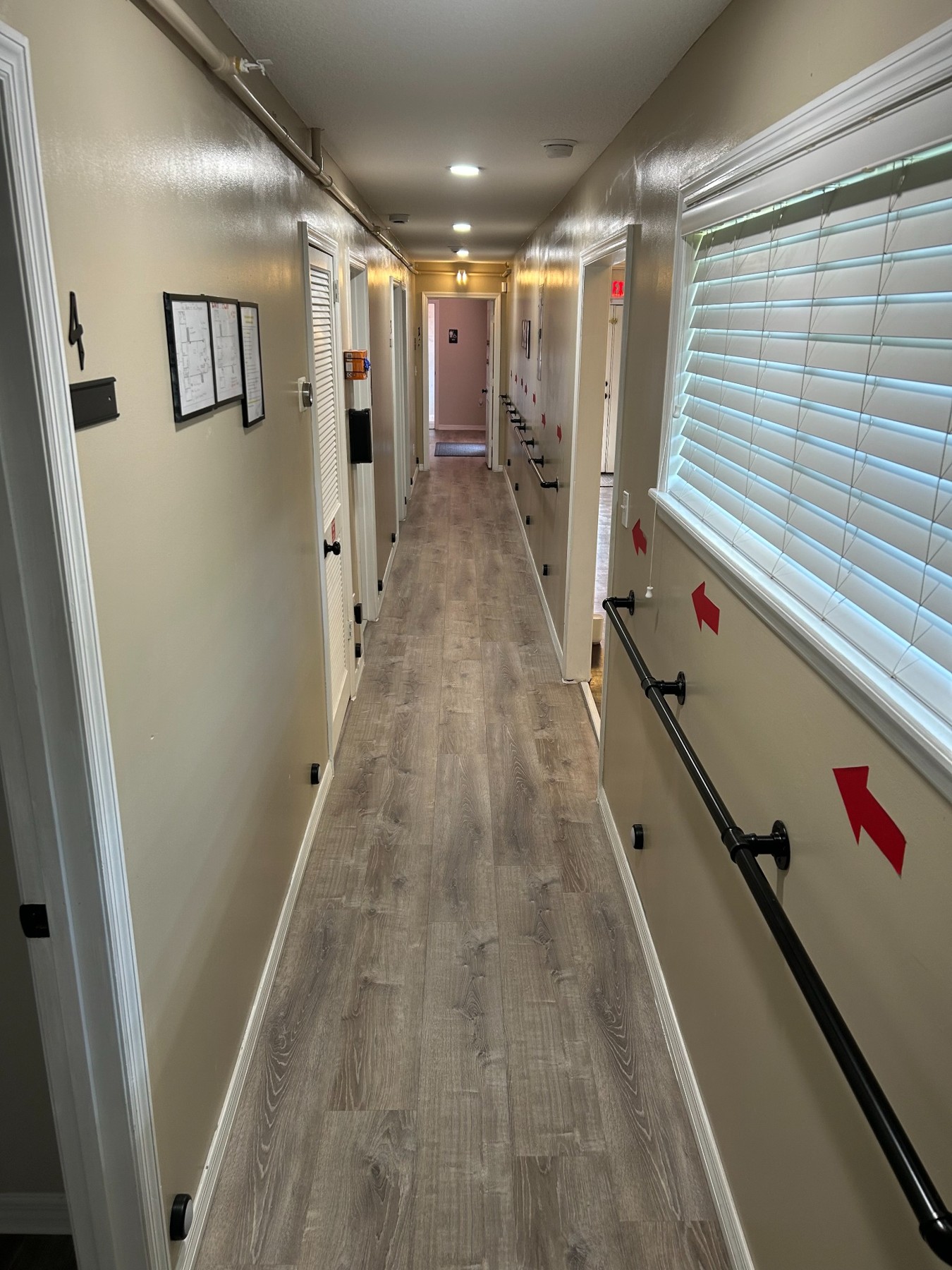 Interior hallway with handrails and room entrances
